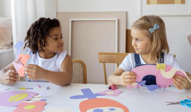 Children playing together and drawing